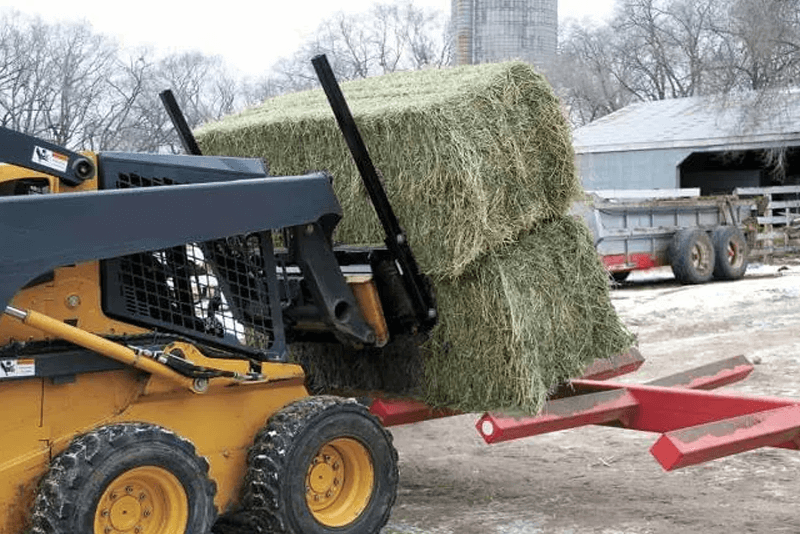 Skid steer bale spear attachments