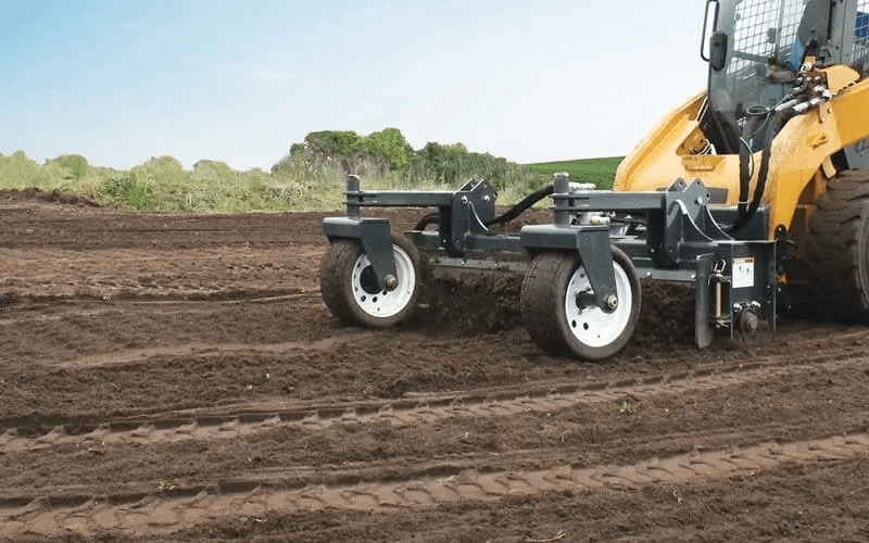 Skid steer soil conditioner attachments